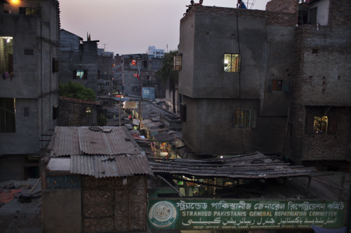 Opens popup gallery with Night time in Geneva Camp Dhaka.  Many ancestors of the Urdu-speaking minority came from Bihar, India, during the partition in 1947. The camps’ residents are referred to as Bihari, which is a loaded term in Bangladesh. Some trace their ancestry back not to Bihar, but to other regions in India and present-day Pakistan