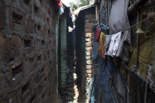 Opens popup gallery with Conditions in the camps are dire. Houses are separated by two-foot (61cm) wide passageways shared by residents, goats and chickens. 
