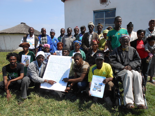 Hobeni community participants showcase materials produced with LRC as part of their legal case. © LRC