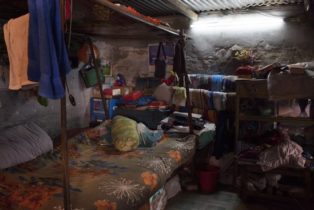 Opens popup gallery with Typically families share one room for sleeping and living in the camps.