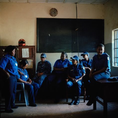 Opens popup gallery with Female police officers gather at the divisional headquarters and central police station in Makeni, Sierra Leone.
