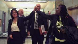 Opens popup gallery with A CLVU attorney (left) and a tenant (right) celebrate a court decision to accept a nonprofit's bid for building purchase